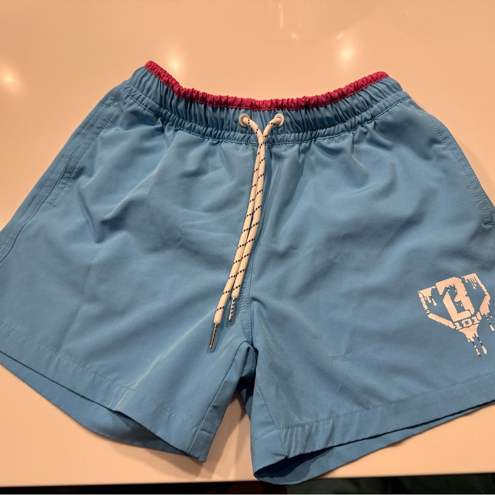 Baseball Lifestyle Swim Trunks Youth Medium. Blue Shorts with Pink Trim